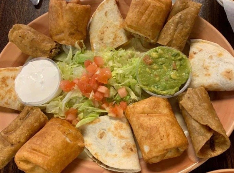 Casa Noble Botanitas sampler platter with chimichangas, quesadillas, and flautas